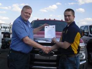 Mike Burns presents Riley Rustad with $1000 Built Ford Tough Scholarship Fargo, ND 